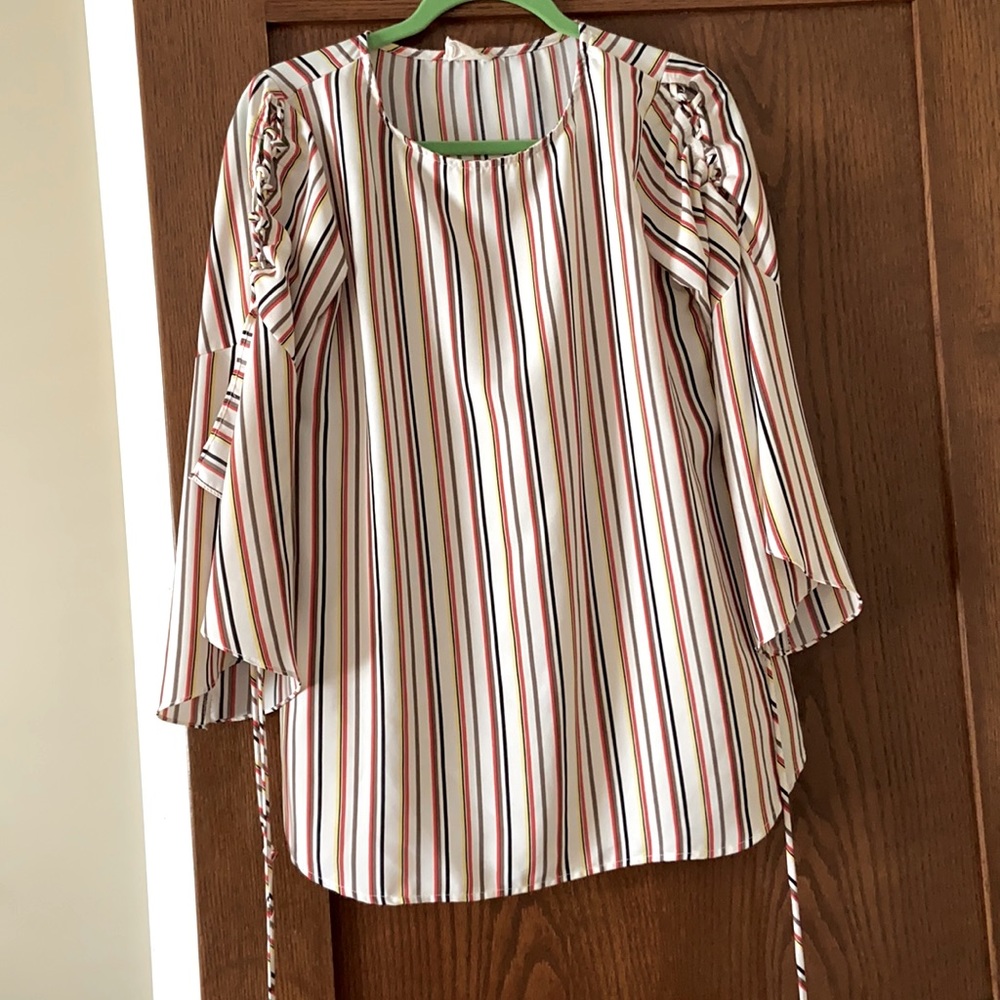 Flattering bell sleeve top!